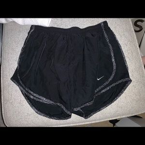 Black with white detailing nike shorts.